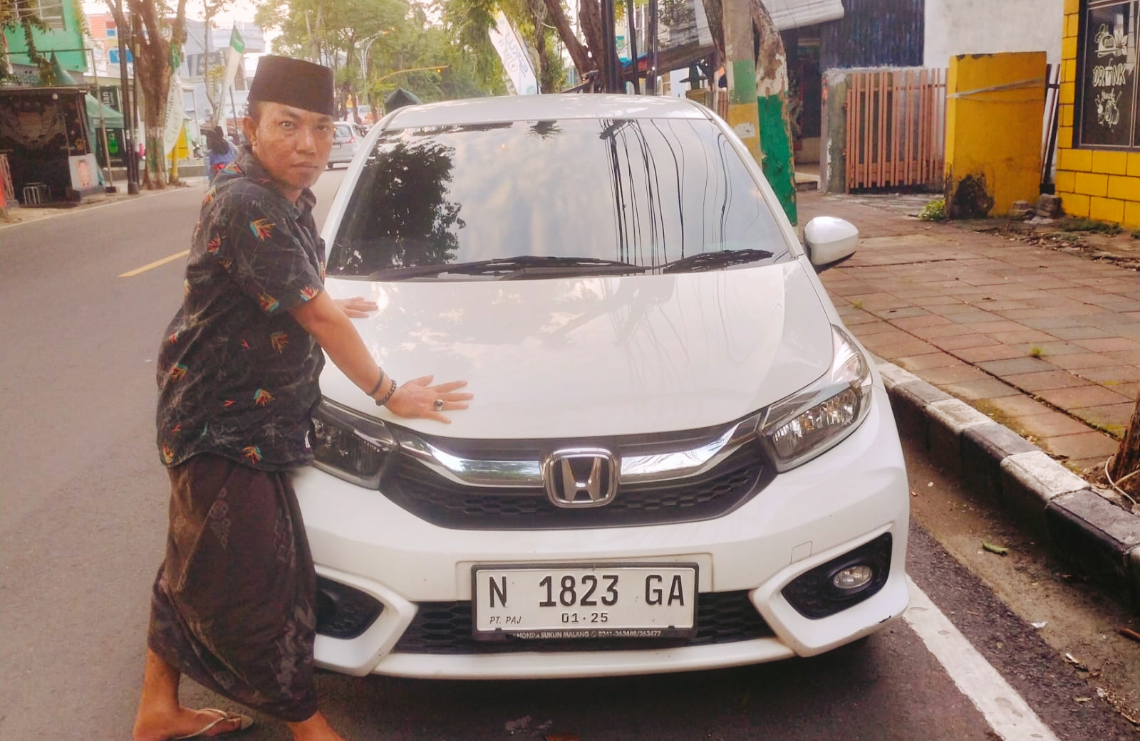 Pemilik STNK Mobil Brio, Zaini.